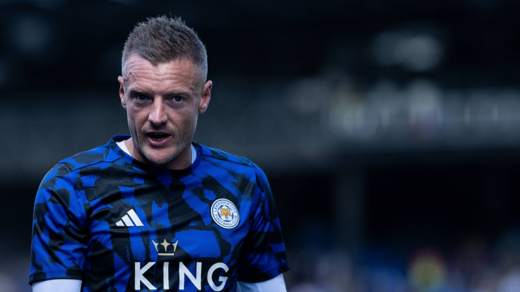 Ex-Leicester City striker Jamie Vardy stares into the distance while warming up before a game.