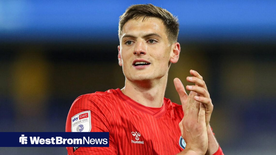 West Brom defender Caleb Taylor applauds supporters