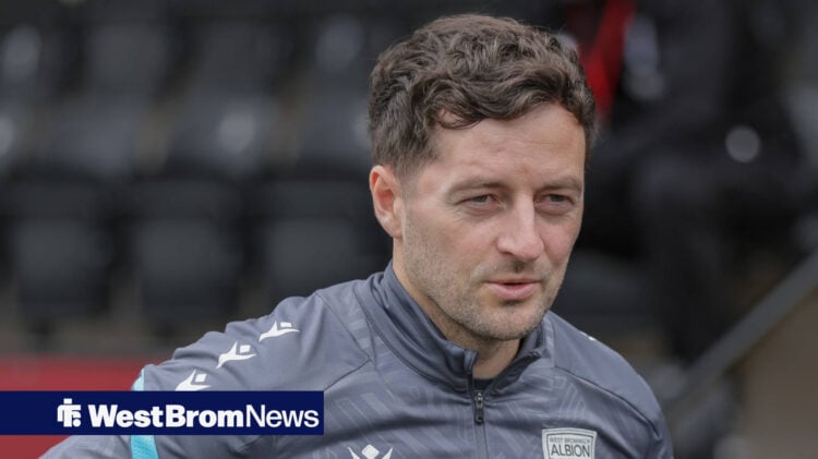 West Brom boss Ryan Mason watches on