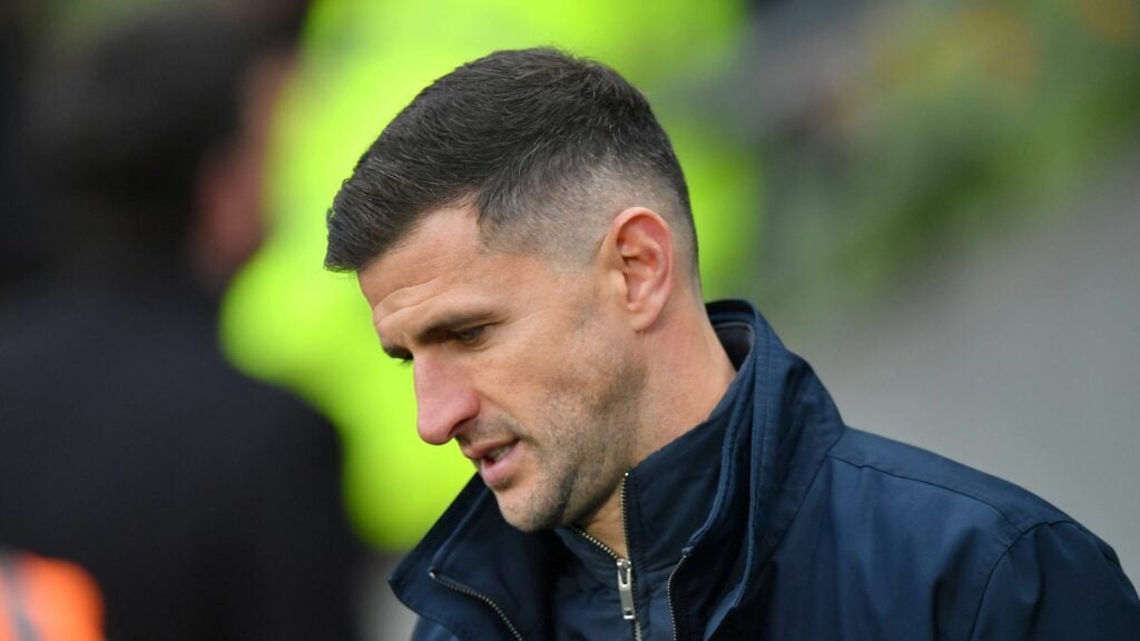 John Mousinho looking annoyed during a Portsmouth game