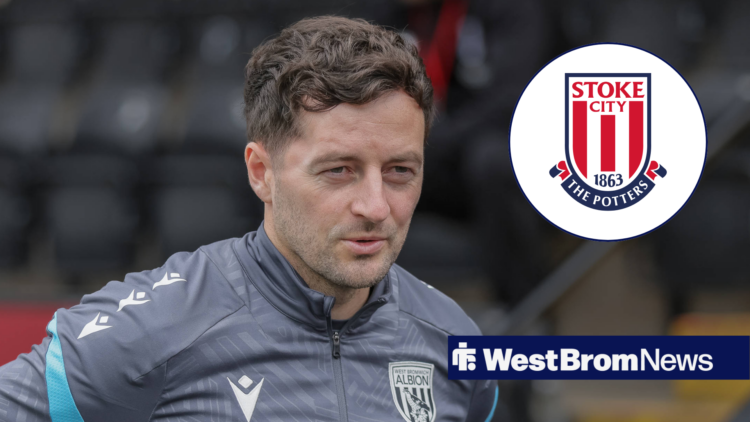 West Brom manager Ryan Mason smiles in the direction of the Stoke City badge.