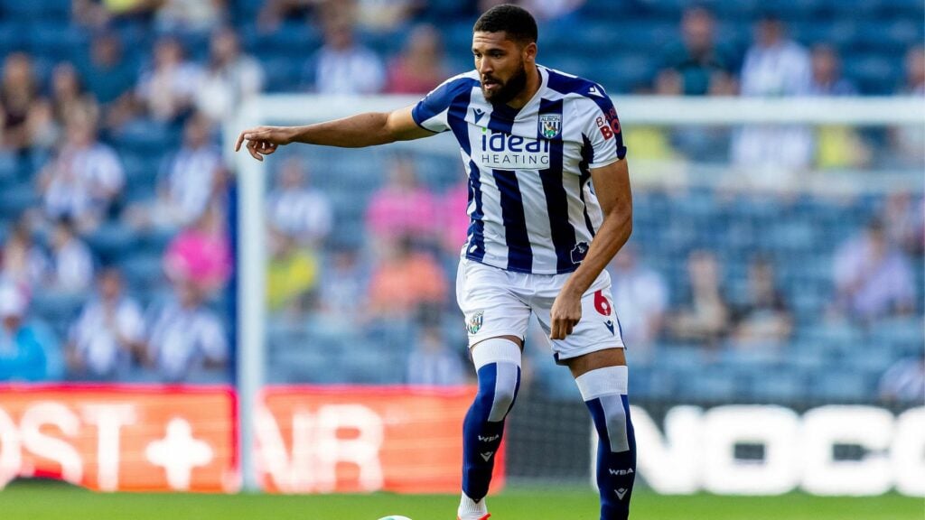 West Brom defender George Campbell with the ball at his feet during a game.