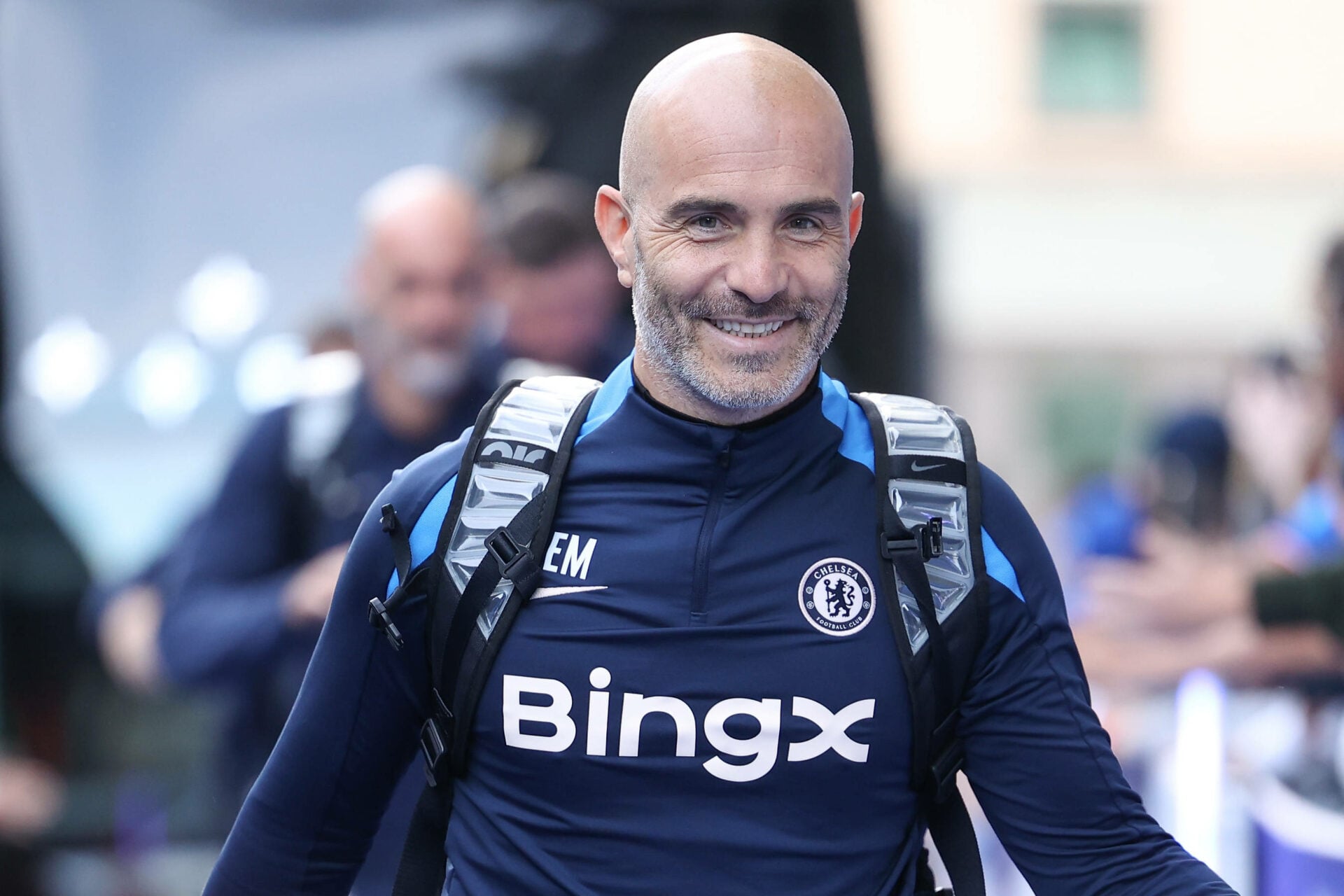Ex-West Brom player Enzo Maresca smiles while arriving for a game as Chelsea manager.