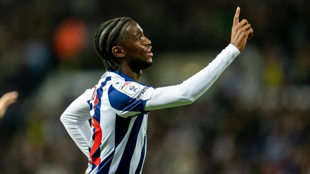 Samuel Iling-Junior celebrates a goal for West Brom against Leicester City by raising a finger in the air.