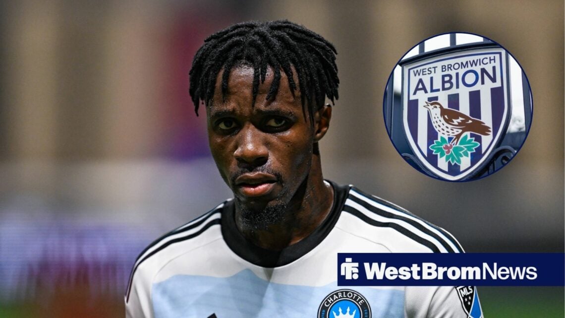 Wilfried Zaha looks towards his left, with a West Brom badge in a circular frame