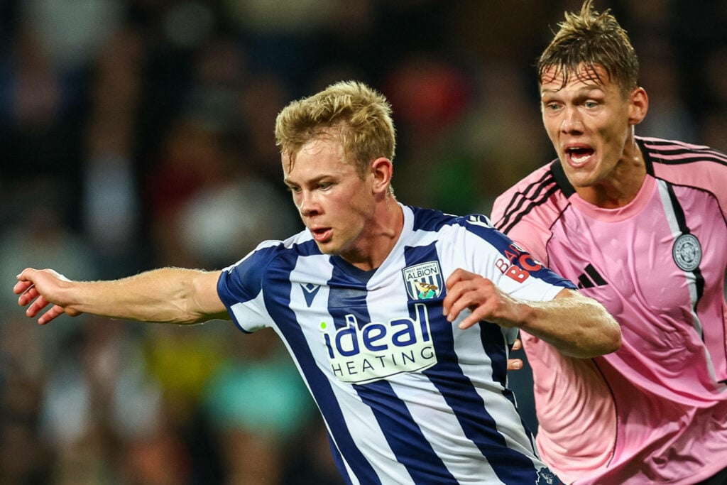 West Brom striker Aune Heggebo battles for the ball against Leicester City