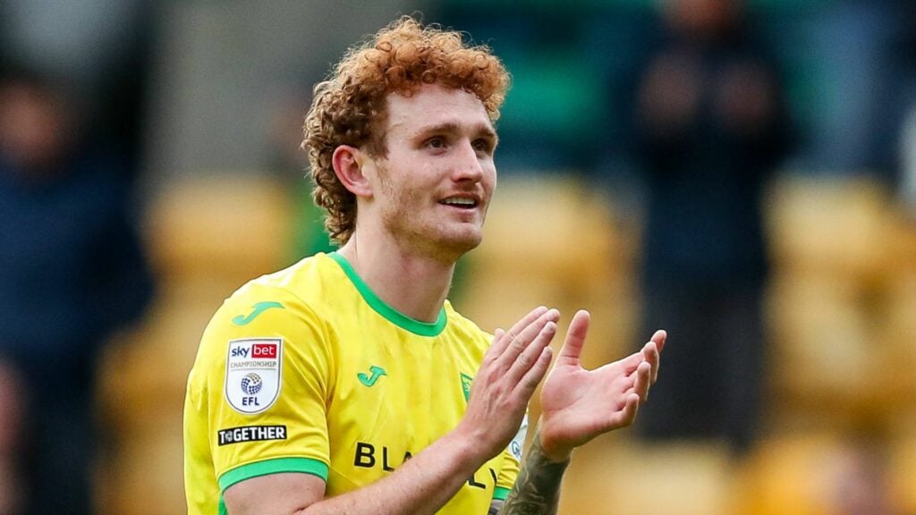 Norwich City striker Josh Sargent applauds the fans after a game.