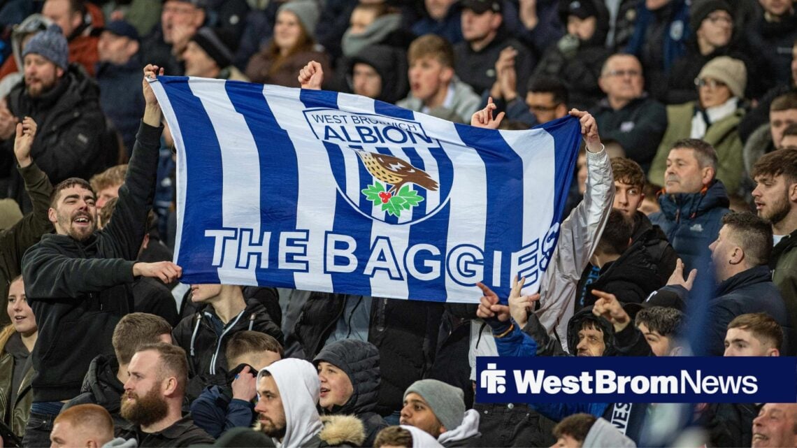 West Brom fans hold up a flag