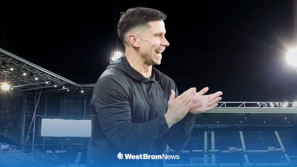 West Brom manager Eric Ramsay clapping his hands and smiling with The Hawthorns in the background