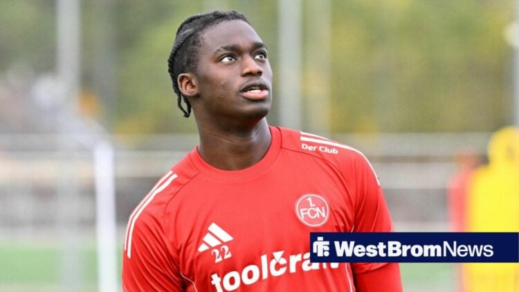 Hindolo Mustapha looks on