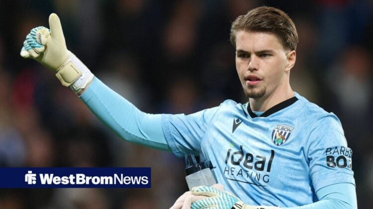 Josh Griffiths with his arm outstretched and his thumb pointed upwards.