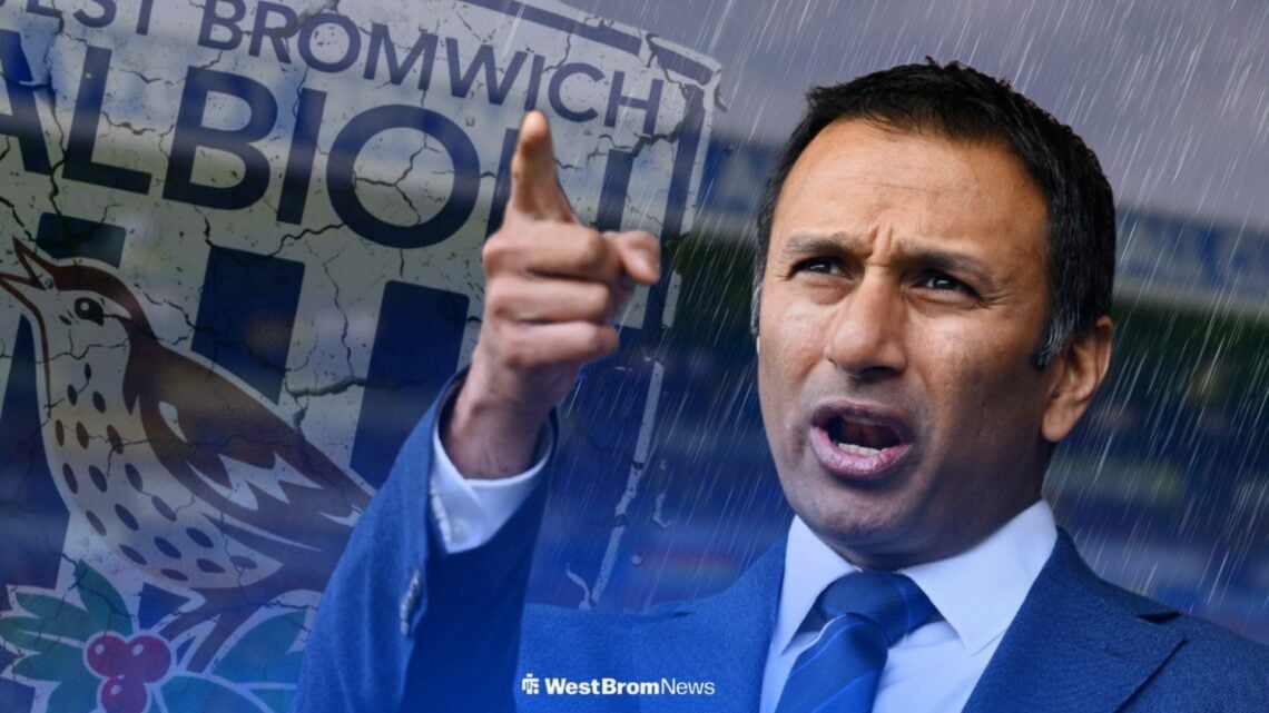 West Brom owner Shilen Patel points his finger, cracking Baggies badge and gloomy conditions in background.