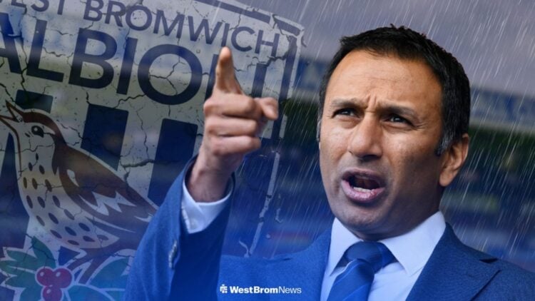 West Brom owner Shilen Patel points his finger, cracking Baggies badge and gloomy conditions in background.