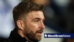 James Morrison smiling on the touchline as West Brom manager