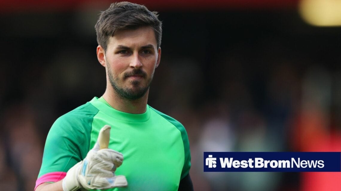 Joe Wildsmith playing in goal holding his thumbs up